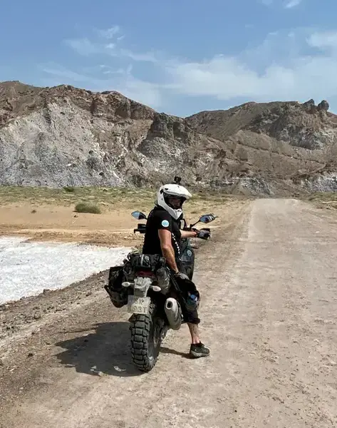Jacek wearing a white helmet on Qeshm Island, Iran