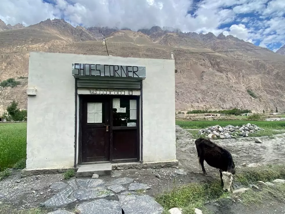 Bizzare valley life. A plan for grazing yaks and sheep on summer pastures  hangs in the windows of the building called "Shoe Corner".