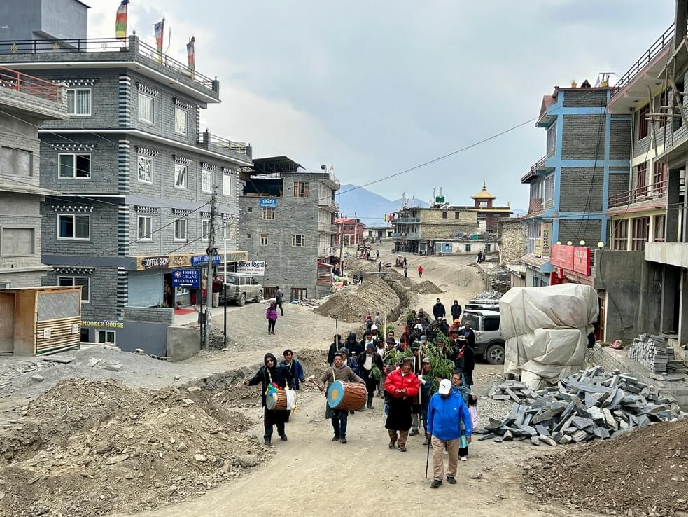 The procession heads to the Archery Day celebrations in Muktinath