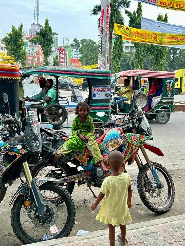 Little kids on our motorbikes in Bangladesh.